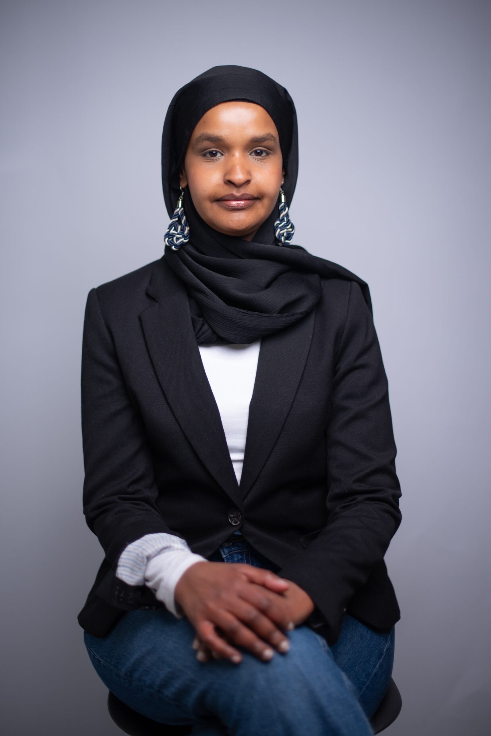 person in black long sleeve shirt holding persons hand